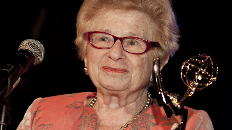 Dr. Ruth Westheimer holding an Emmy