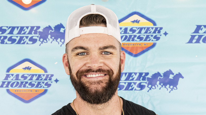 Dylan Scott smiles at an event