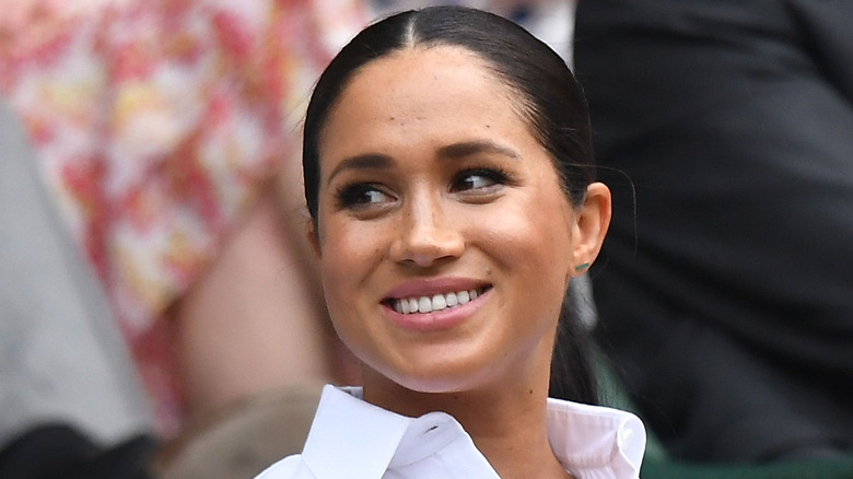 Meghan Markle smiles at an outing