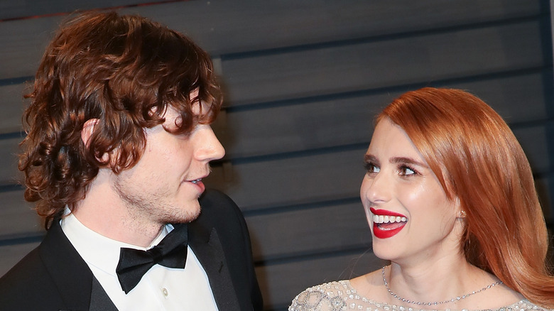 Evan Peters, Emma Roberts, looking at each other