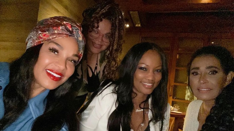 Garcelle Beauvais smiling with Sheree Zampino