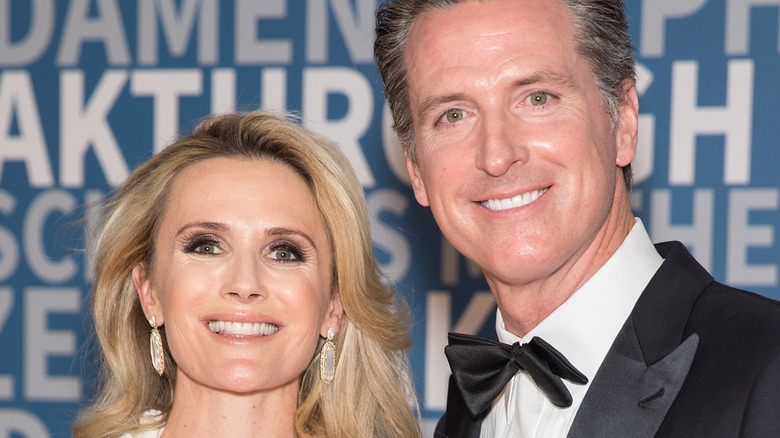 Jennifer Siebel and Gavin Newsom smiling at film awards