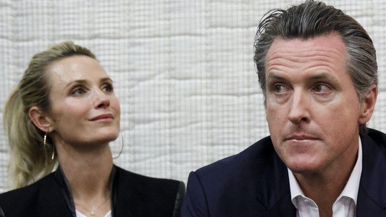 Jennifer Siebel and Gavin Newsom looking serious