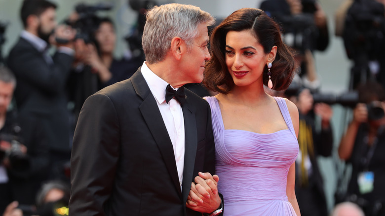 George Clooney gazing at Amal Clooney