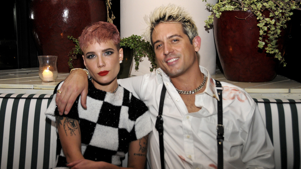 Halsey, seated with ex G-Eazy's arm around her 