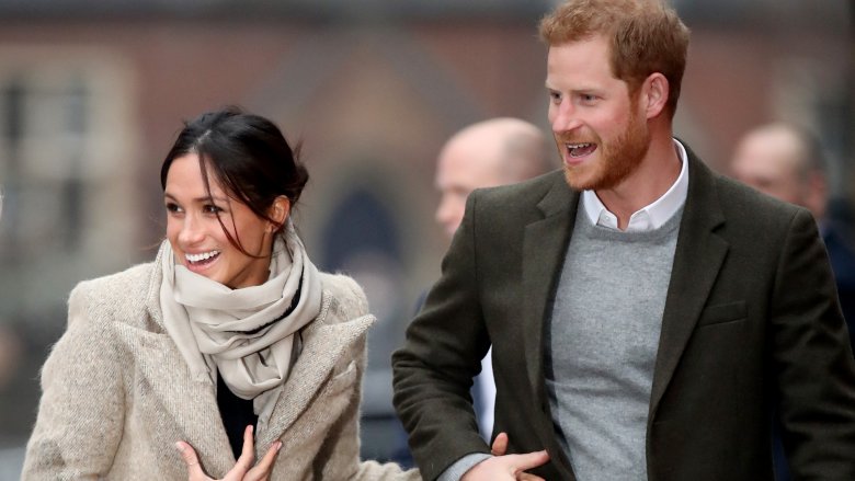 Meghan Markle and Prince Harry holding hands