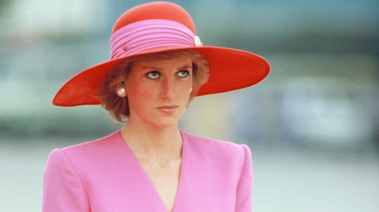 Princess Diana in a pink hat and outfit