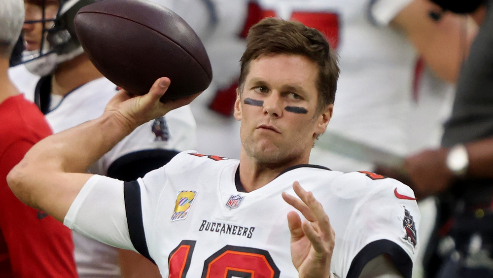 Tom Brady throws football