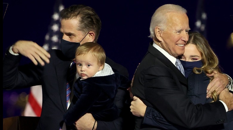 Hunter Biden holding son beau next to Joe Biden