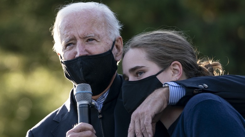 Joe Biden with Maisy Biden wearing face masks