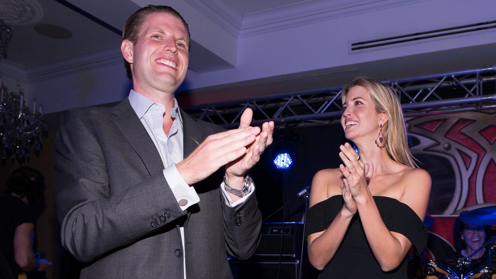 Eric Trump and Ivanka Trump clapping at a concert