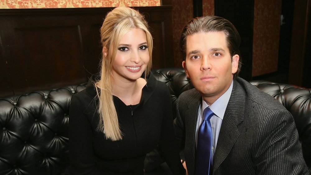 Ivanka Trump and Donald Trump Jr. sitting on black leather sofa