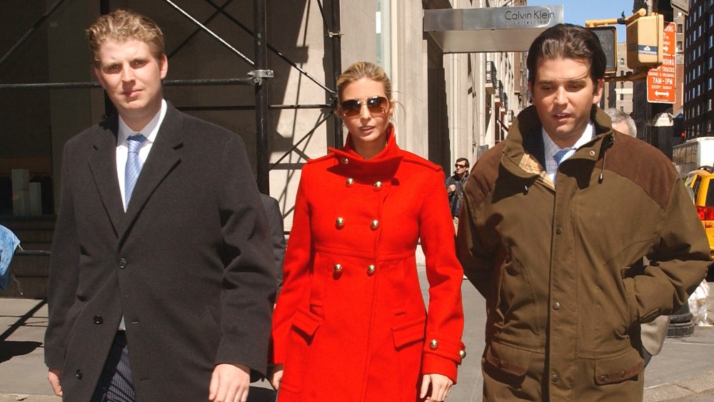 Eric Trump, Ivanka Trump, and Donald Trump Jr. all walking outside