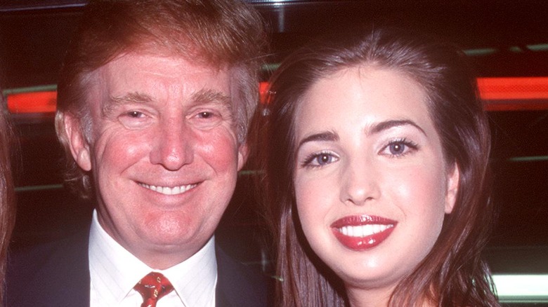 Donald Trump and Ivanka Trump smiling and posing together at the NYC 2000 Fashion Show