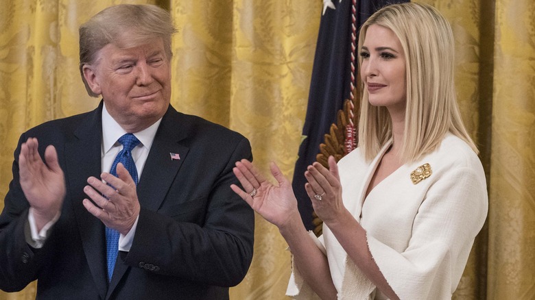 Donald Trump clapping with daughter Ivanka Trump