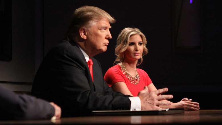 Donald Trump and Ivanka Trump in matching red, sitting in similar poses on The Apprentice