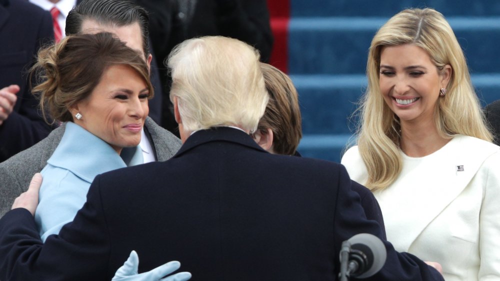 Melania Trump, Donald Trump, and Ivanka Trump smiling on inauguration day