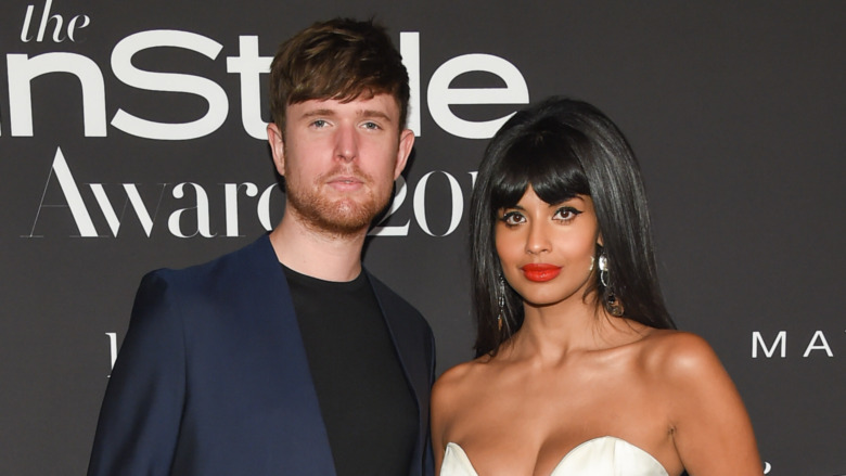 James Blake and Jameela Jamil posing at a red carpet event