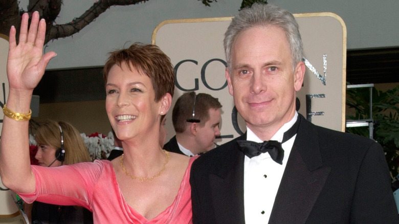 Jamie Lee Curtis and Christopher Guest posing on the red carpet