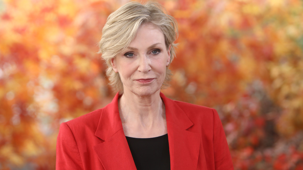 Jane Lynch in an outdoor fall setting