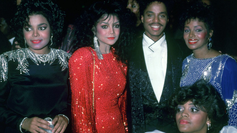 Young Janet Jackson with siblings, all glammed up and smiling