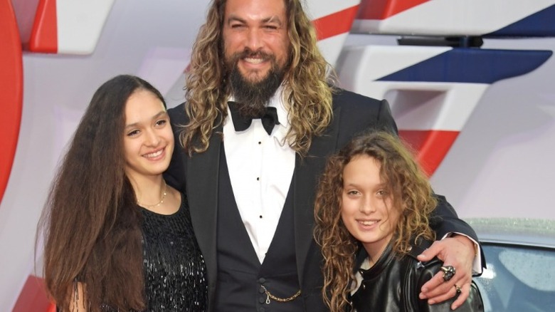 Jason Momoa smiling with his kids