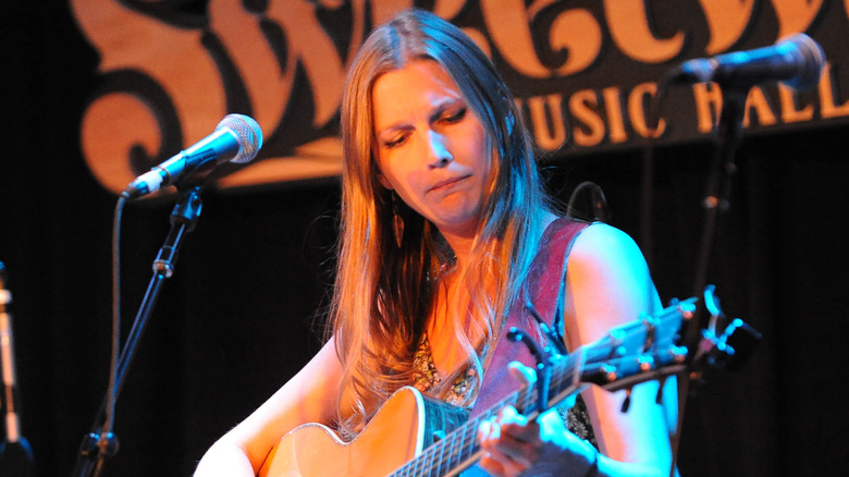 Jessie Bridges playing guitar