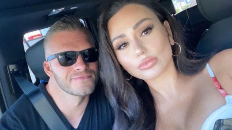 JWoww and Zack Carpinello posing in the car 