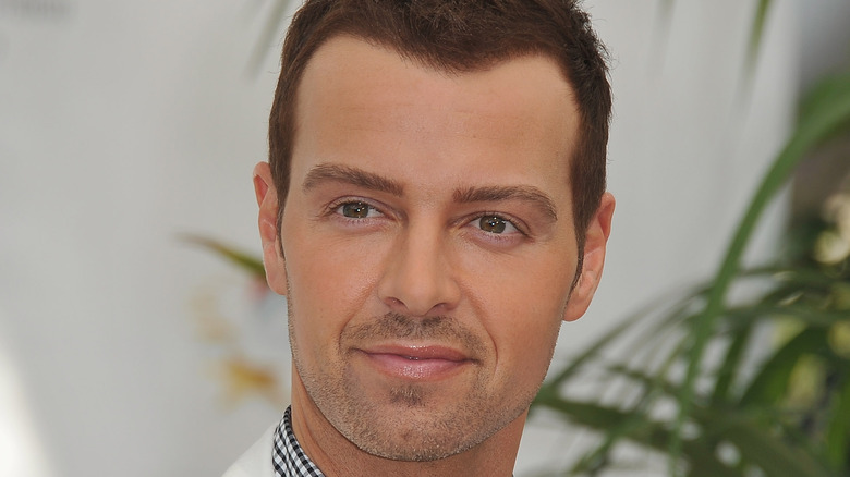 Joey Lawrence in a white suit 