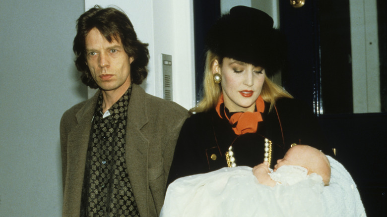 Mick Jagger, Jerry Hall, and baby