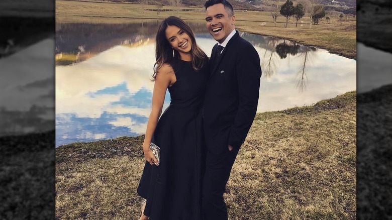 Jessica Alba and Cash Warren laughing in black