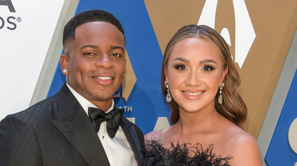 Jimmie Allen and Alexis Gale posing