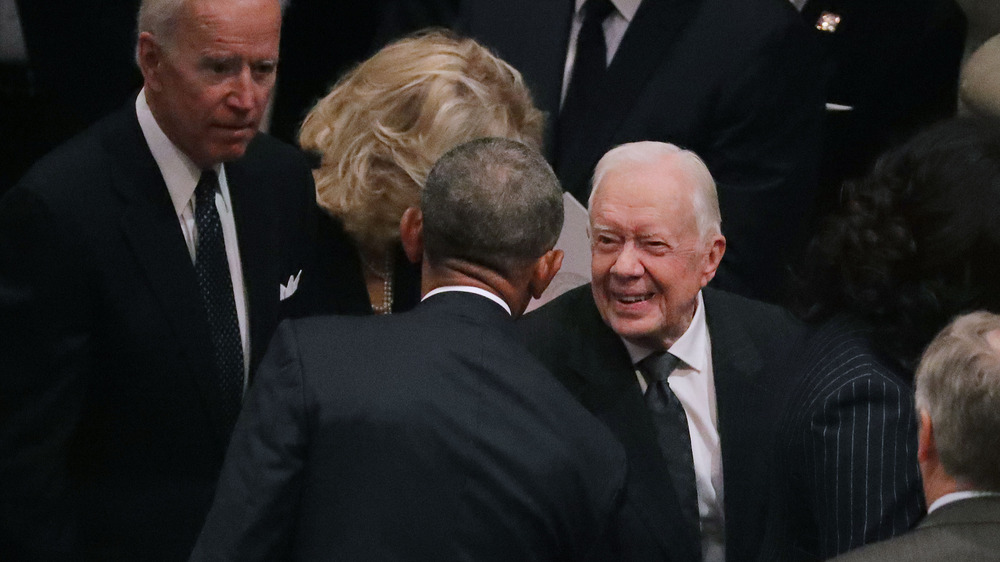 President Obama greeting Jimmy Carter 