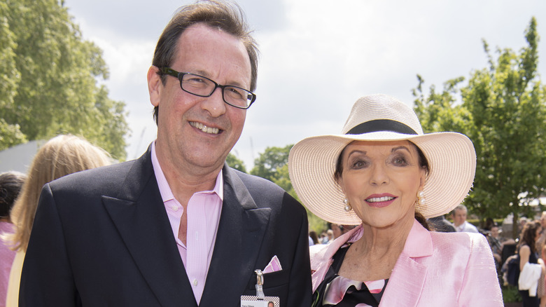 Percy Gibson and Joan Collins smiling at an event