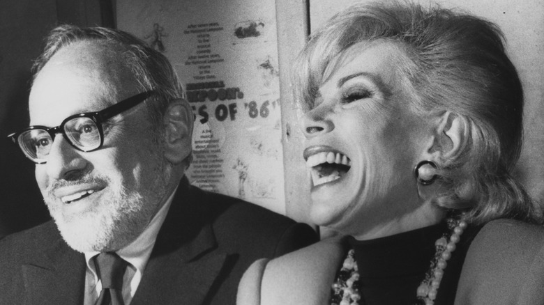 Edgar Rosenberg and Joan Rivers laughing