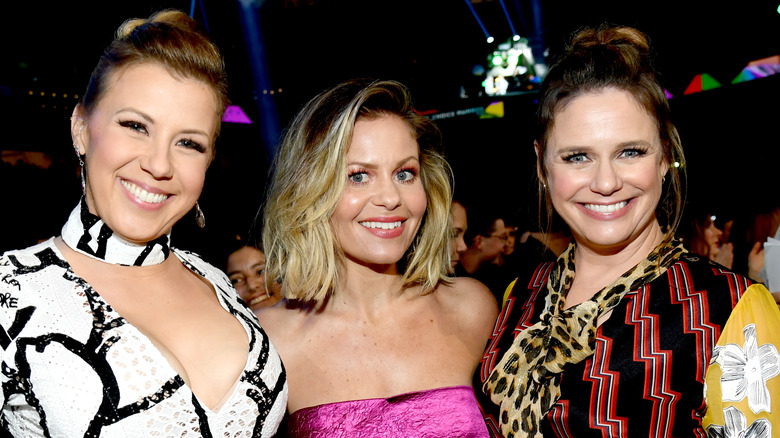 Jodie Sweetin, Candace Cameron Bure, and Andrea Barber posing