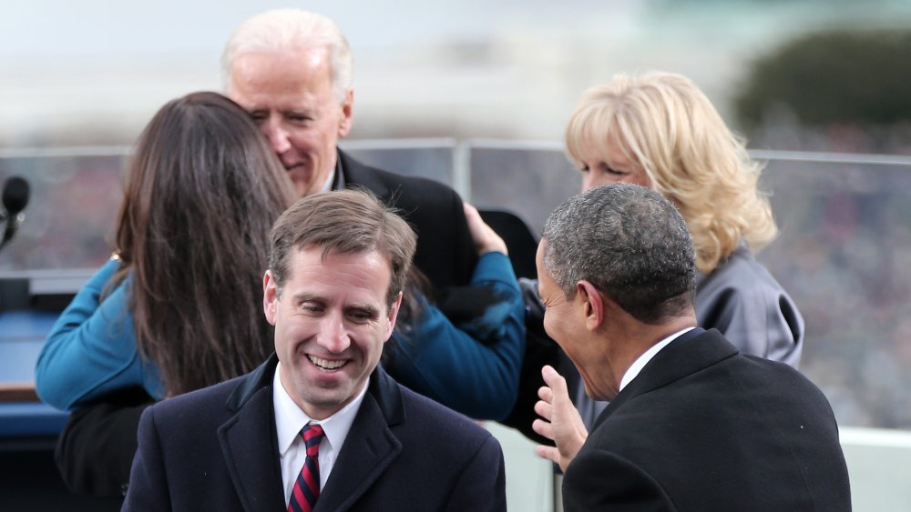 Barack Obama greeting Beau Biden, while Joe and Jill Biden stand behind