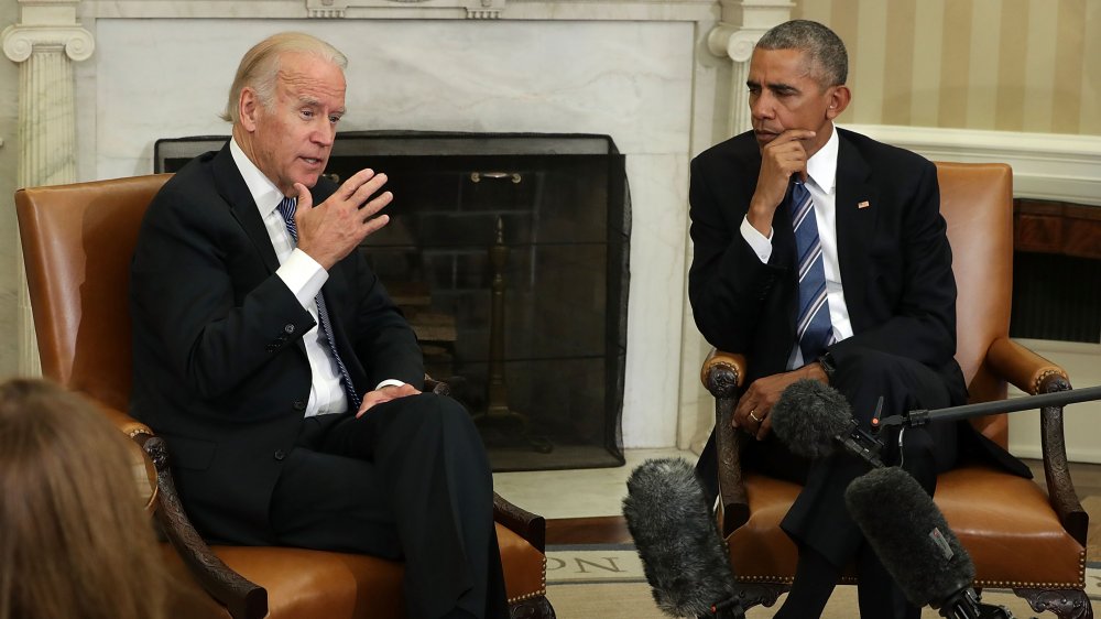 Joe Biden and Barack Obama talking in the Oval Office