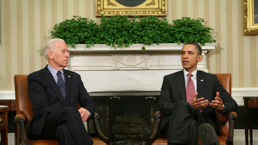 Joe Biden and Barack Obama seated in the Oval Office