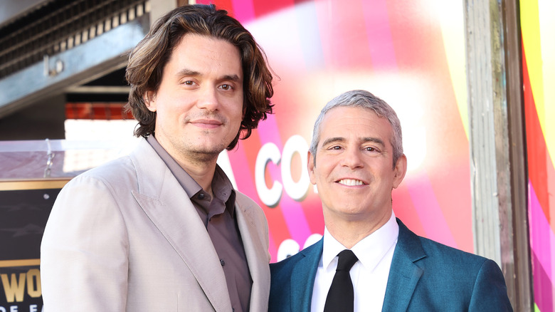 John Mayer and Andy Cohen posing