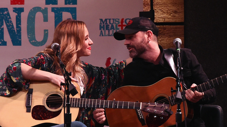 Jessi Alexander and Jon Randall with guitars