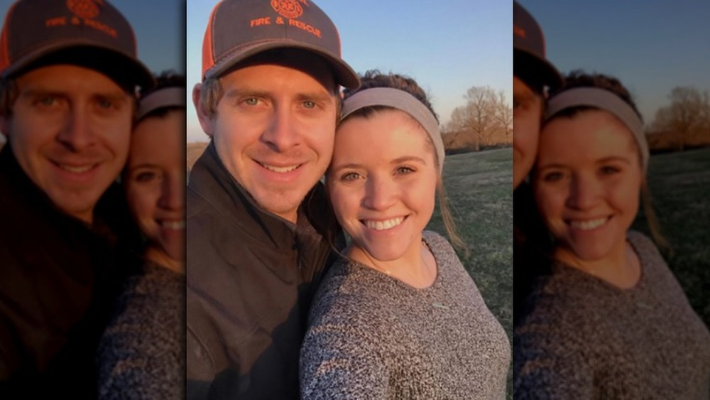 Austin Forsyth, wearing a hat; Joy-Anna Duggar, selfie, outside, hair up in bun