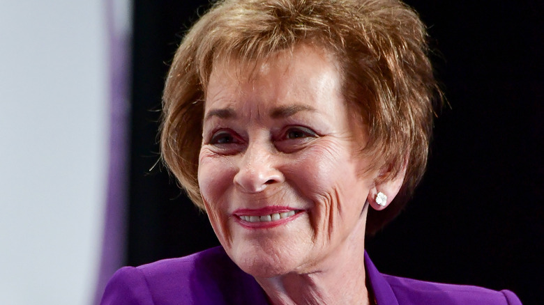 Judy Sheindlin smiles on at an event