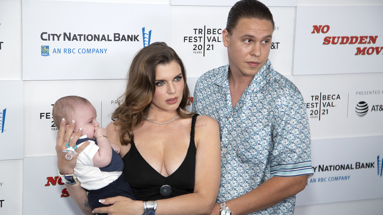 Julia Fox posing with her ex-husband and son