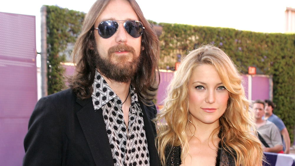 Chris Robinson and Kate Hudson posing at an event