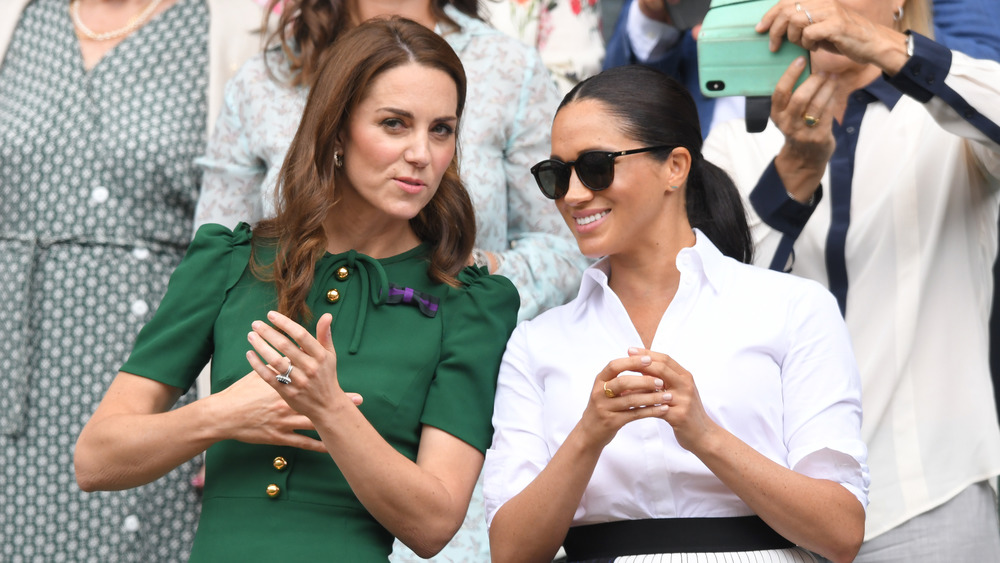 Kate Middleton and Meghan Markle chatting