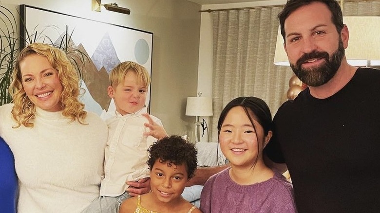 Katherine Heigl, Josh Kelley, with their children, smiling