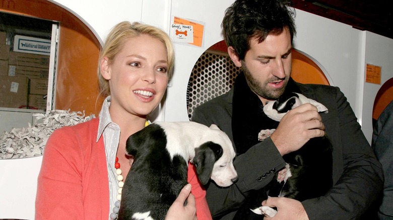 Katherine Heigl, Josh Kelley, holding puppies