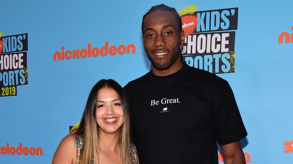 Kawhi Leonard and Kishele Shipley pose