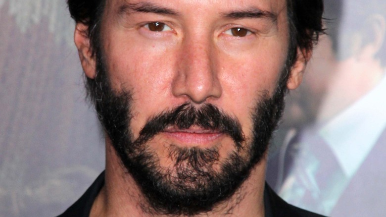 Keanu Reeves wearing a V-neck